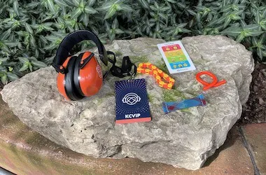 KultureCity sensory kit items including headphones, fidgets and communications cards.