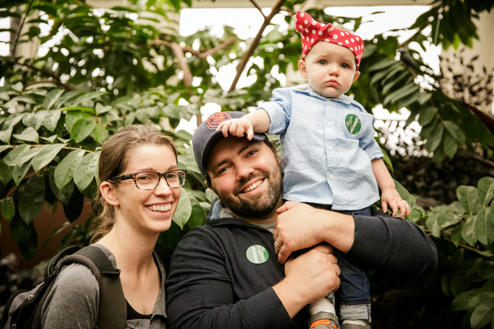 Young couple with baby, all three wearing GPCA Member stickers.