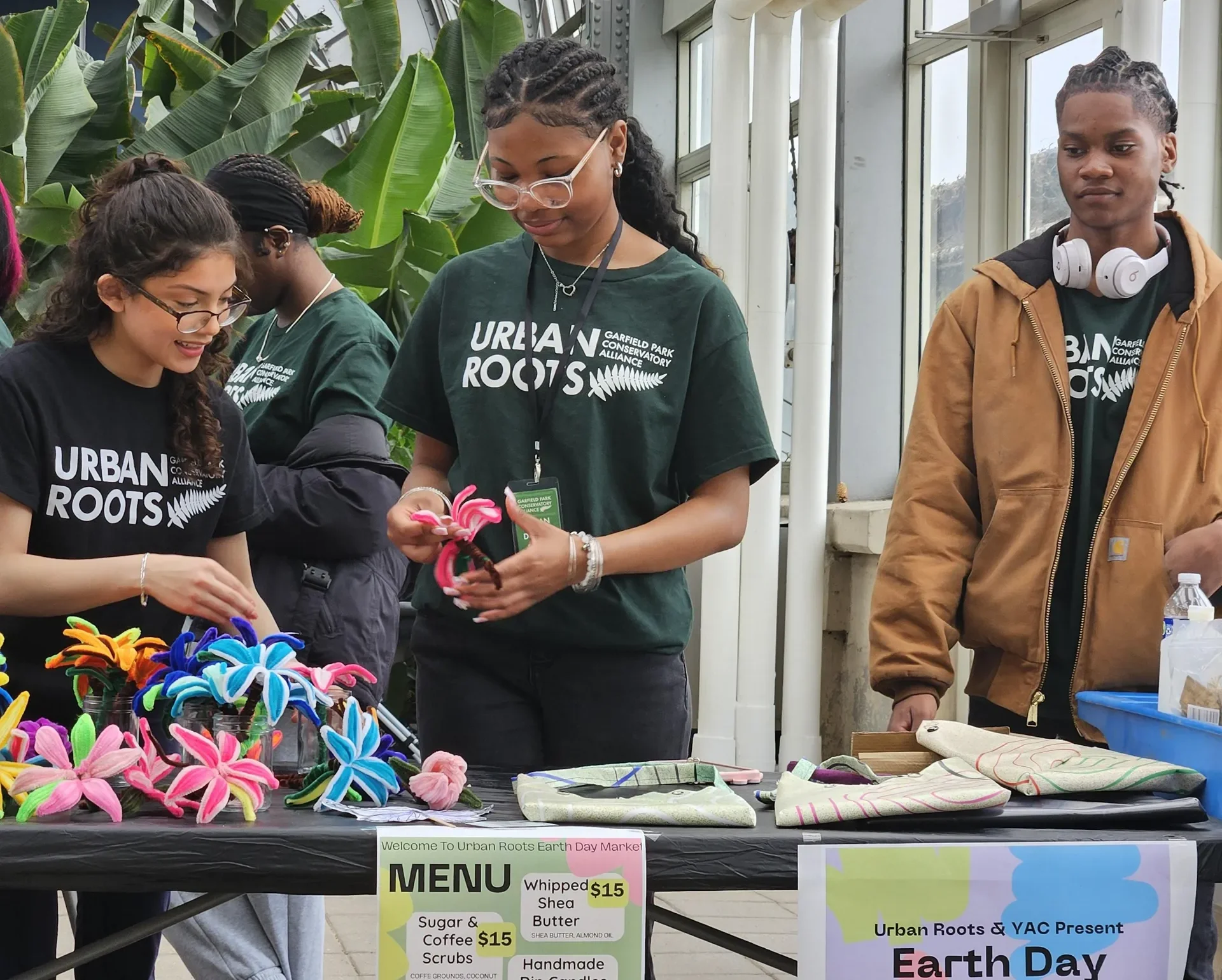 Urban Roots teens selling items at the Earth Day market